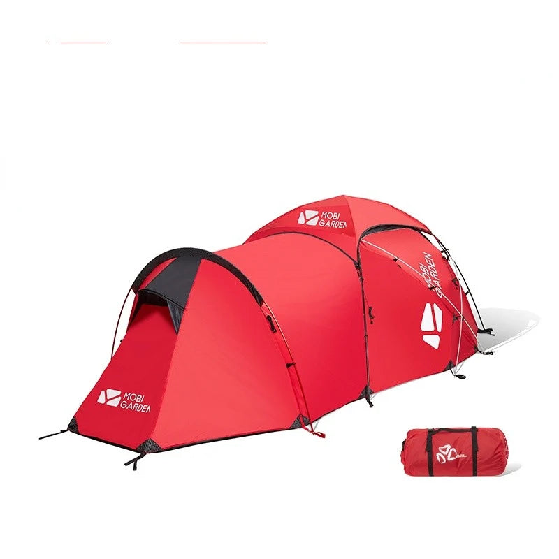 Red expedition tent with matching carry bag on white